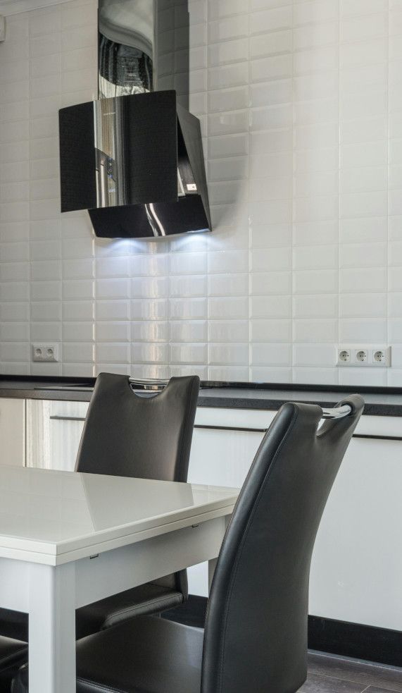 Swansea kitchen wall tiled in clean white porcelain.